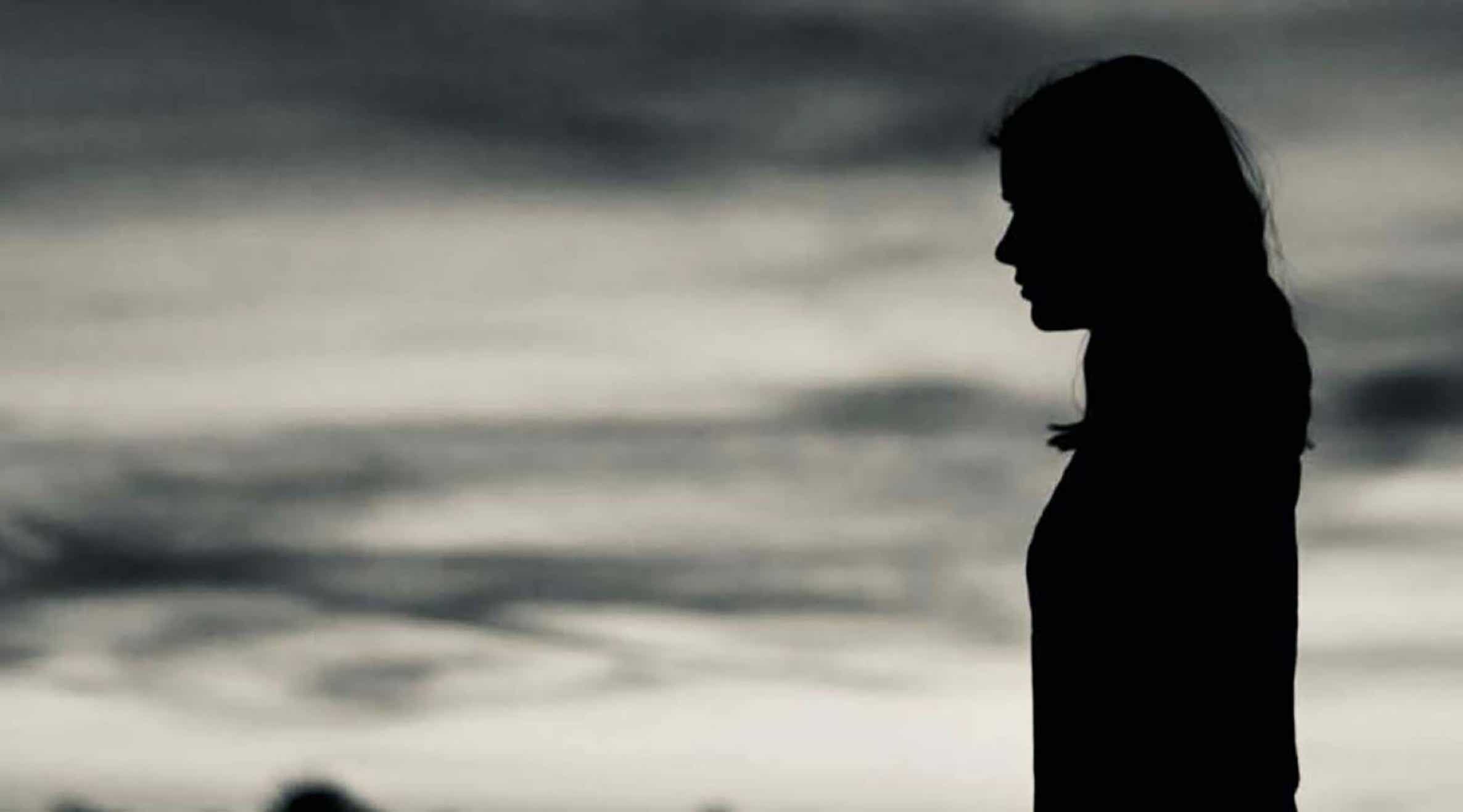 Header image: a girl in shadows